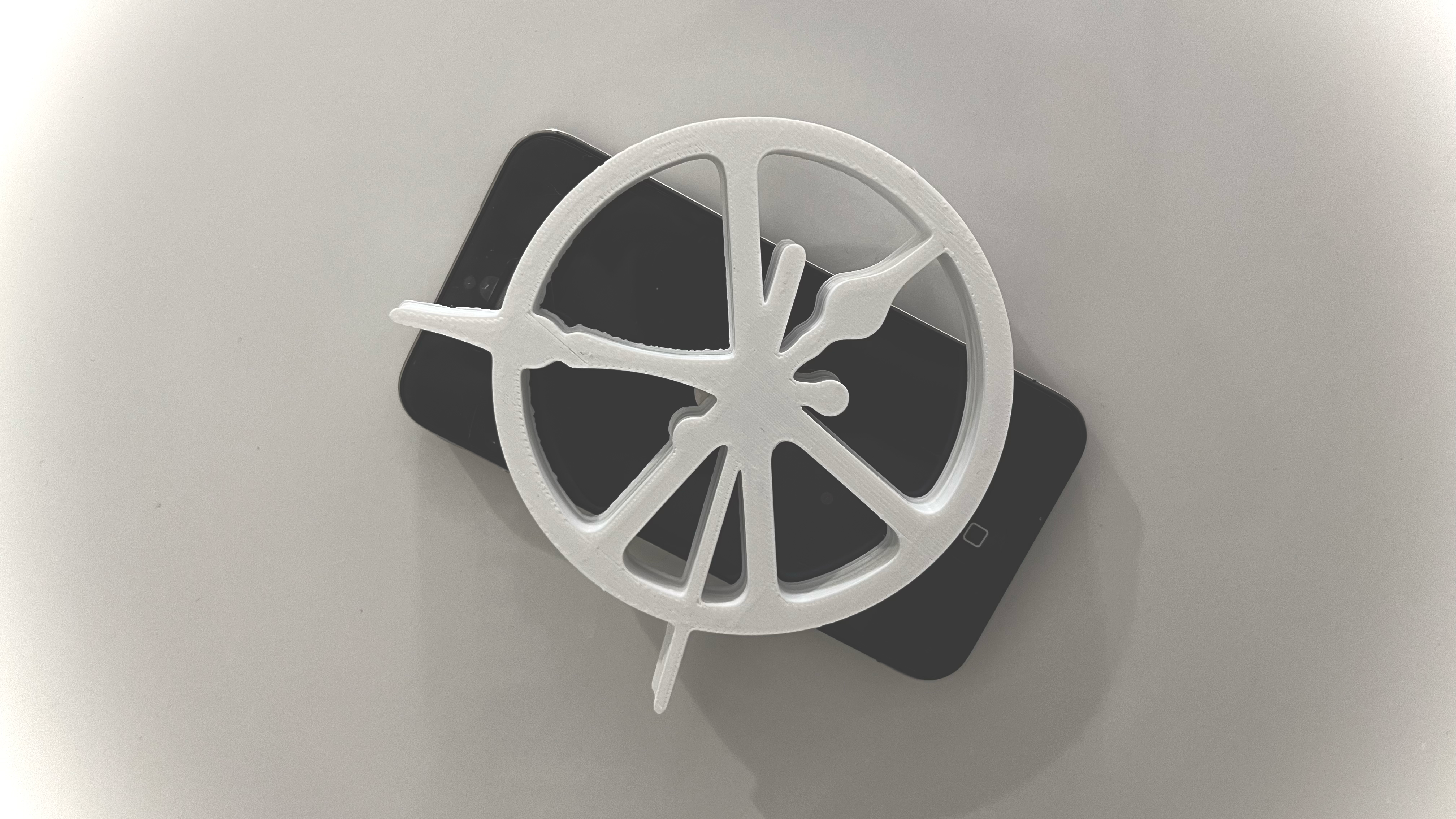 Close view of the white peace and clock symbol on a phone
